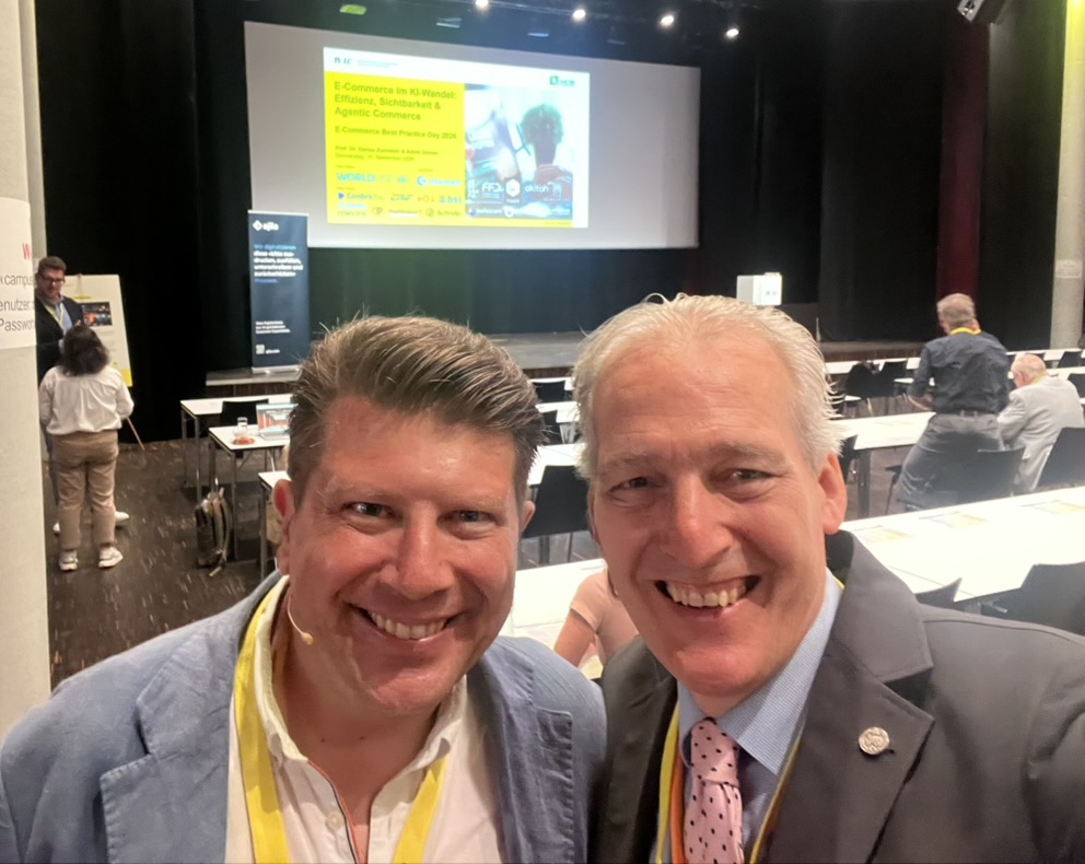 Two conference participants in the FHNW auditorium
